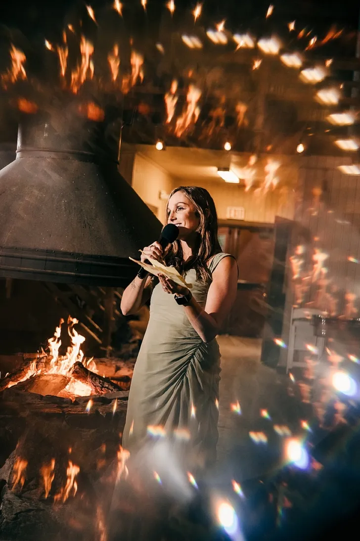bridesmaid giving a toast during wedding reception