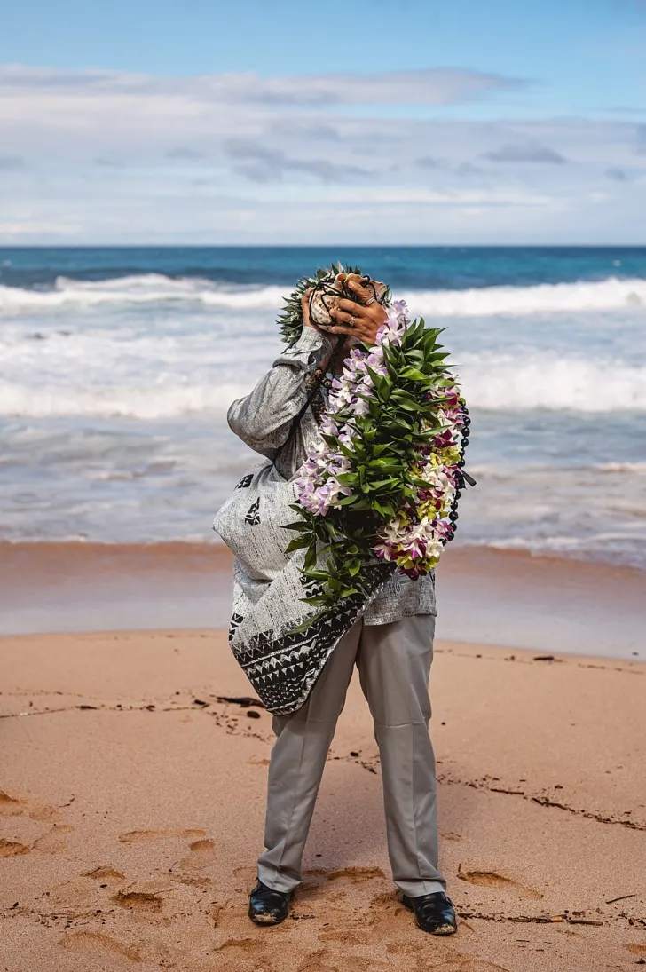 officiant during wedding ceremony on beach
