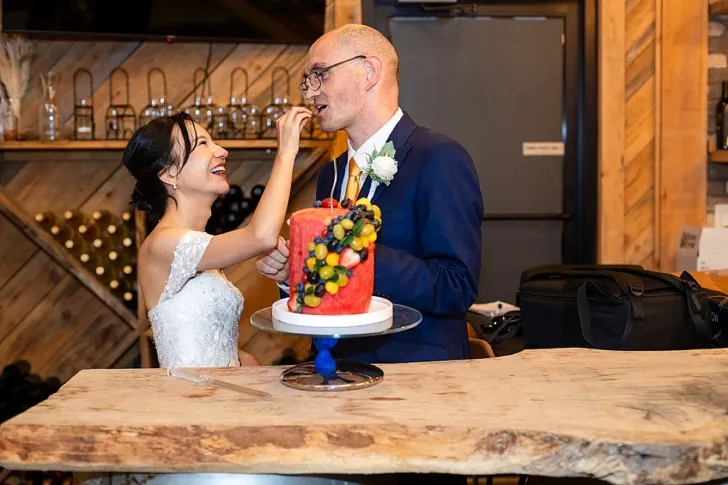 bride feeding groom cake