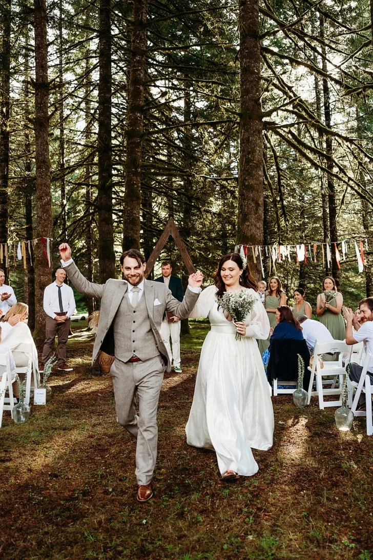bride and groom celebrating after wedding ceremony