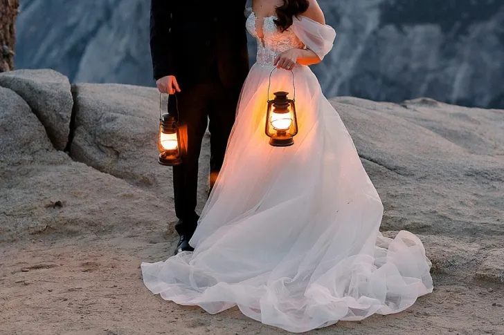 bride and groom holding lanterns