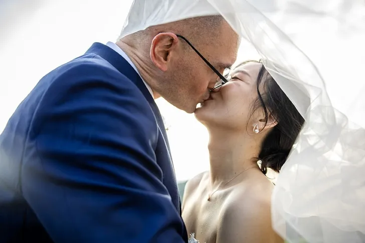 bride and groom kissing