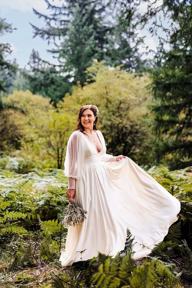 bride posing in forest in Oregon