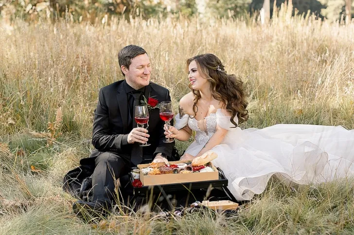 bride and groom having wine and charcuterie
