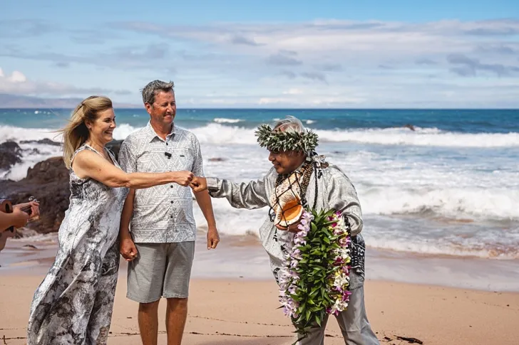 bride and officiant fist bumping during wedding ceremony
