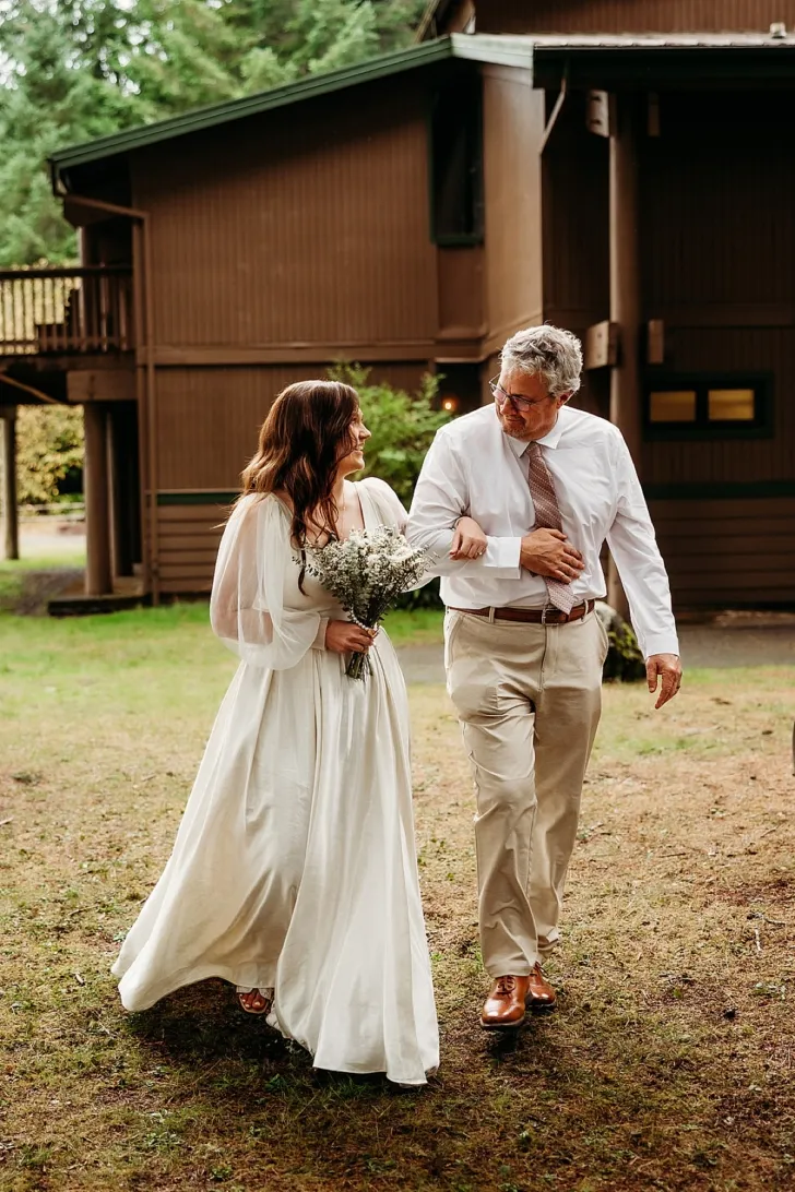 bride and father of the bride walking down the aisle
