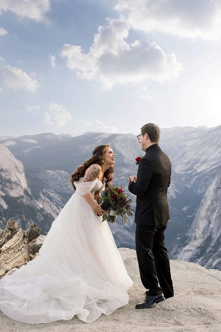 bride and groom laughing during wedding ceremony
