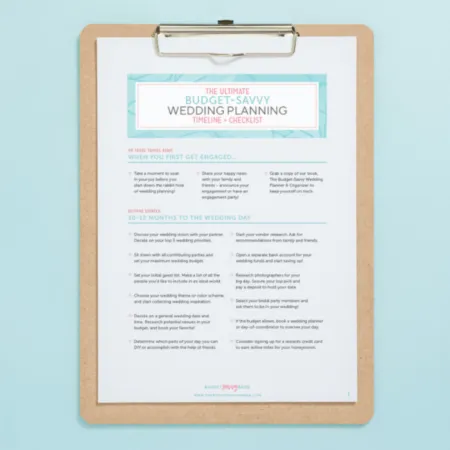 An organized wedding planning checklist displayed on a clipboard, designed with a clean layout and vibrant accents. It provides a timeline and steps for couples to follow, ensuring a smooth and budget-friendly wedding planning process.