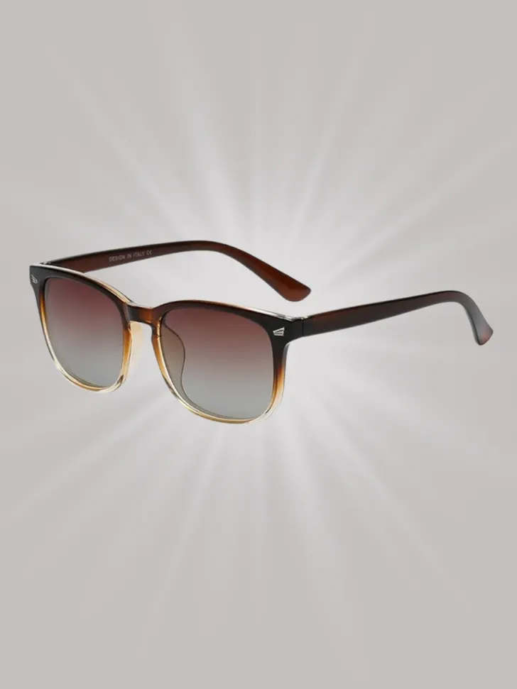 A pair of stylish sunglasses with gradient lenses and a classic frame, perfect for providing both eye protection and a chic look during sunny vacations or beach outings.