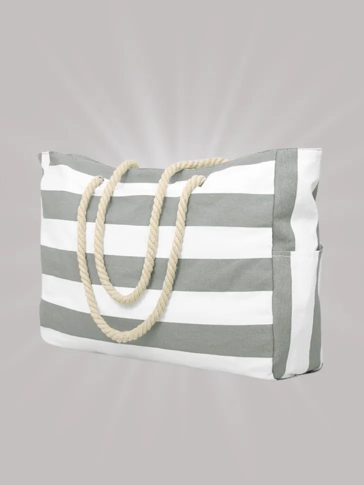 Striped beach tote with rope handles and side pocket.