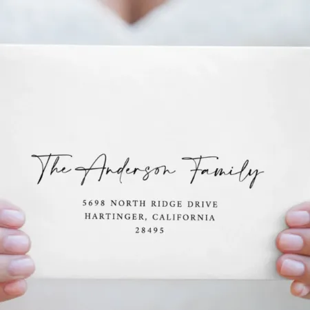An elegant wedding envelope featuring a personalized address in a combination of delicate handwritten and classic serif fonts, adding a sophisticated touch to wedding invitations or thank-you notes.