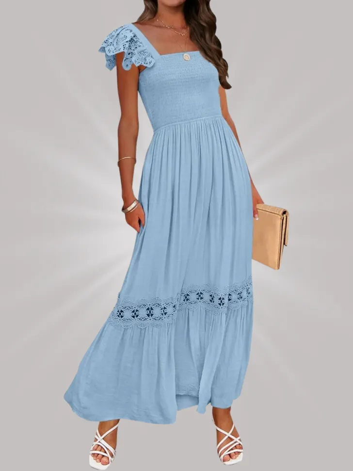 Light blue maxi dress with crochet lace details, flutter sleeves, and a square neckline, paired with white strappy sandals and a tan clutch.